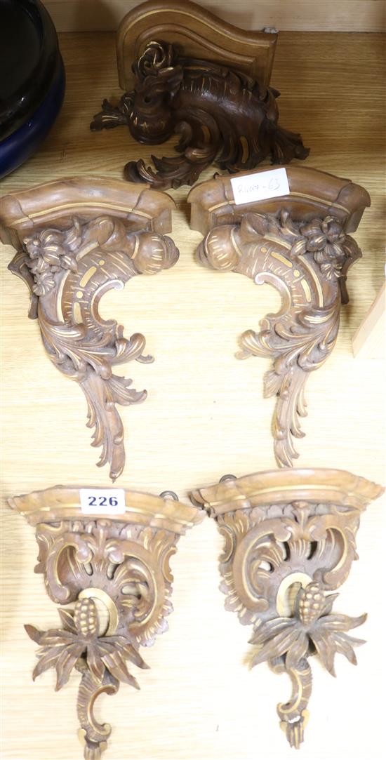 Five carved painted brackets